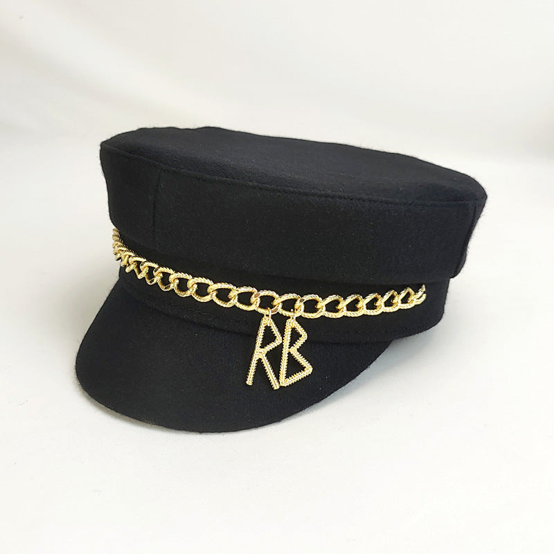 帽子の女性の秋冬の新型のファッションのチェーン海軍の帽子rbアルファベットの百合の帽子の屋外の暖かいアヒルの舌打ち帽です